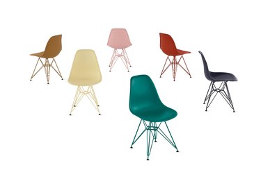 Six Eames plastic side chairs in teal, light yellow, light brown, light pink, red, and navy over a white background.