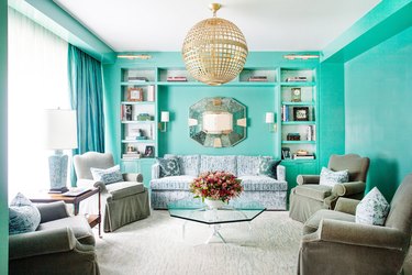 sage green furniture with turquoise walls