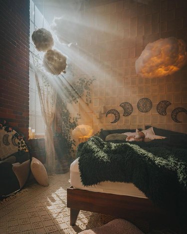 bedroom with cloud-shaped light fixtures