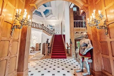 foyer with suit of armor and grand staircase