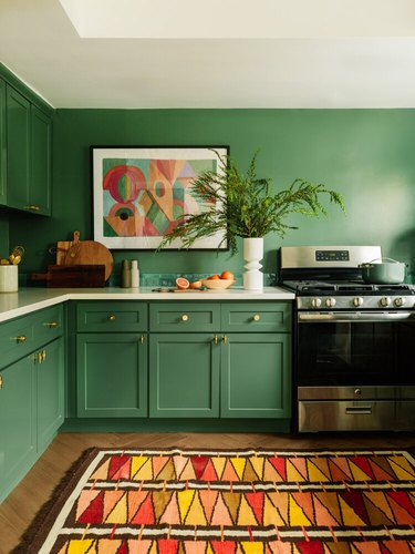 green kitchen with red and yellow accent colors