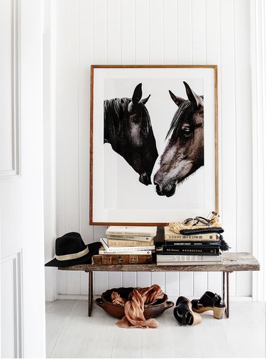 poster print of two horses over rustic bench