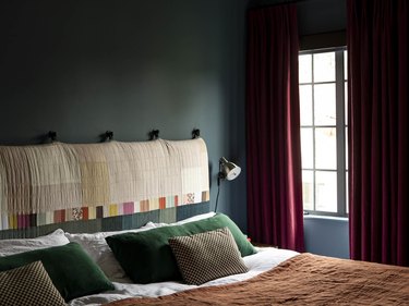 red, green, and dark blue bedroom color idea