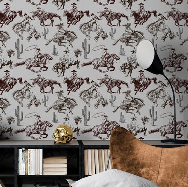 cowboy western wallpaper design behind black bookcases