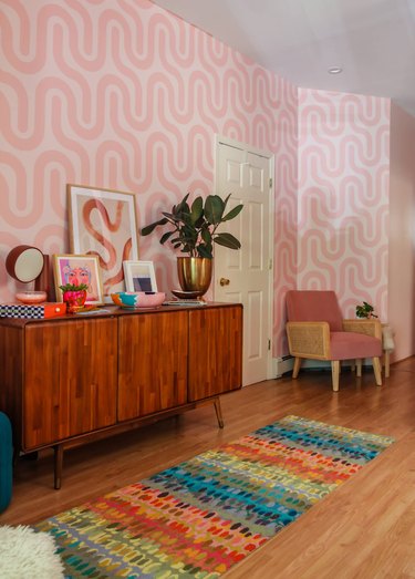 retro entryway with patterned pink wallpaper
