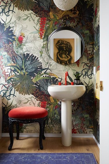 red, green, and greige wallpaper in powder room