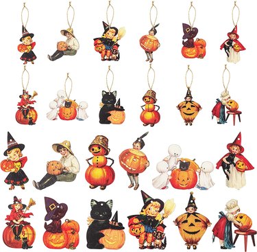 37 wooden flat ornaments featuring vintage-looking Halloween characters like ghosts, black cats, pumpkins, and kids dressed up like witches.
