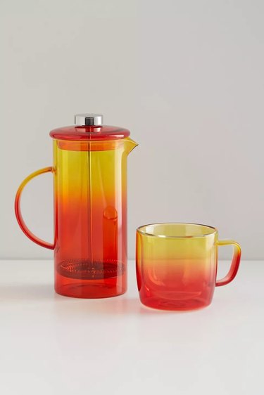 Yellow and orange glass French press and matching cup