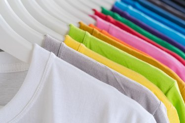 multicolored t-shirts on hangers