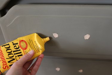 Filling the existing hardware holes with wood filler