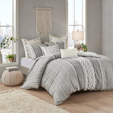 Gray and white patterned queen bedding
