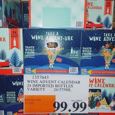 Costco Wine Advent Calendar on the shelves at Costco with a price tag reading $99.99.