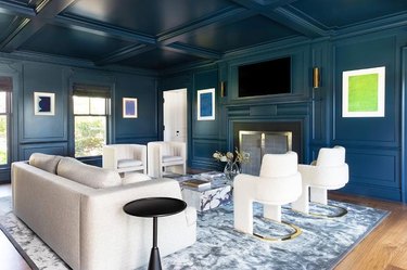 living room with royal blue ceiling and walls and contemporary furniture.