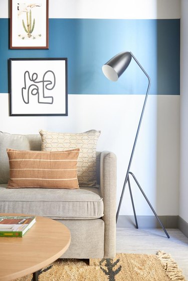 blue stripe on white wall with wall art
