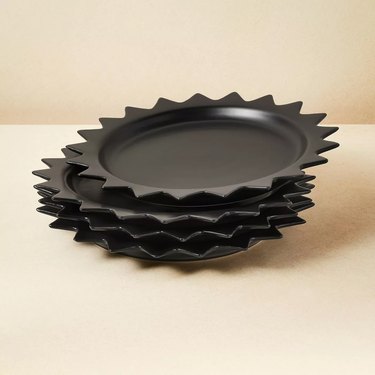 stack of black dishes with spiky corners
