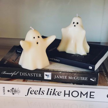 ghost candles on books