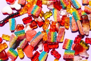 assorted candy on pink background