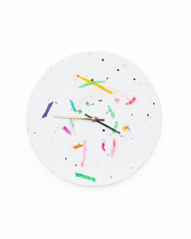 white clock with multicolored design