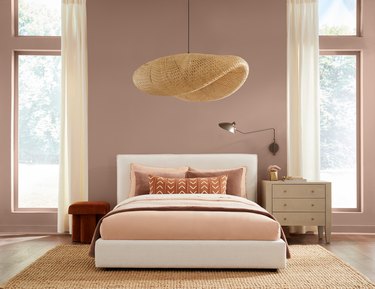 A light red-beige bedroom with a big bed