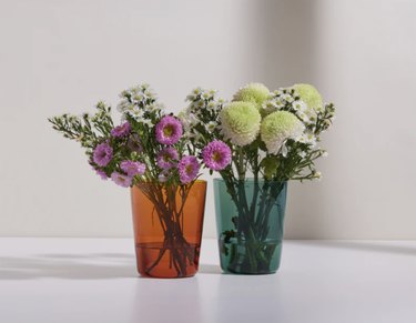 flowers in colored vases