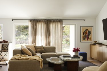 The cozy family room of a home renovated by designer Jessica Nicastro.