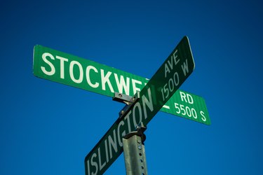 two green street signs: stockwell road and islington avenue
