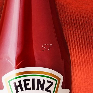 Heinz ketchup bottle zoomed in to the number 57 engraved on the bottle