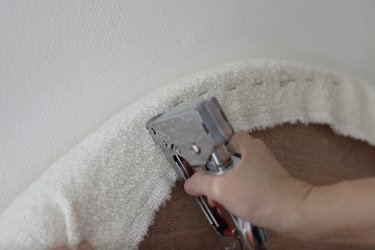 Stapling boucle fabric to back of headboard