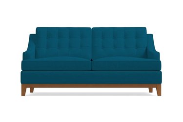 blue sofa with wooden base