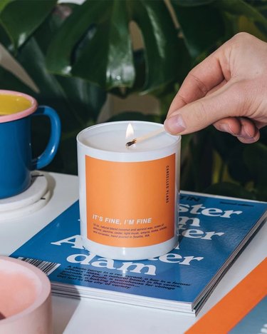 orange candle on book