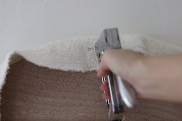 Stapling boucle fabric to back of headboard