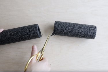 Cutting excess length off foam pipe insulation tube