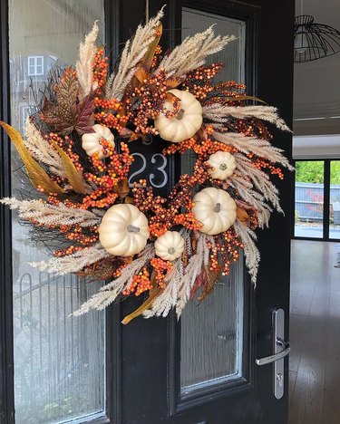 An autumnal wreath with pumpkins