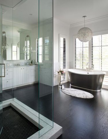 black and white bathroom with plantation shutters
