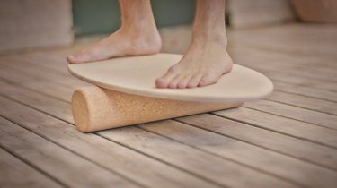 person's feet on balance board