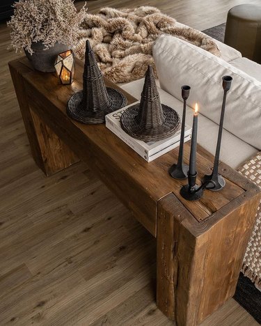 Rustic wooden table with wicker witch hats