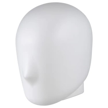 white lamp in shape of a head