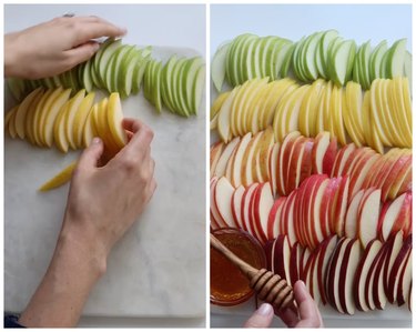 On the left is a hand laying out green and yellow apple slices on a white board. On the right is sliced apples colored like a rainbow from green, to yellow, to orange, to red. There is a small bowl of honey in the corner.