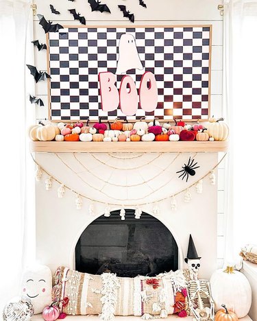 Mantel with black and white Halloween decorations