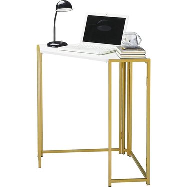 small white corner desk with brass legs