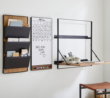 wall-mounted folding desk with whiteboard and wall-mounted organization system