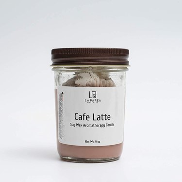 candle with label reading "cafe latte"