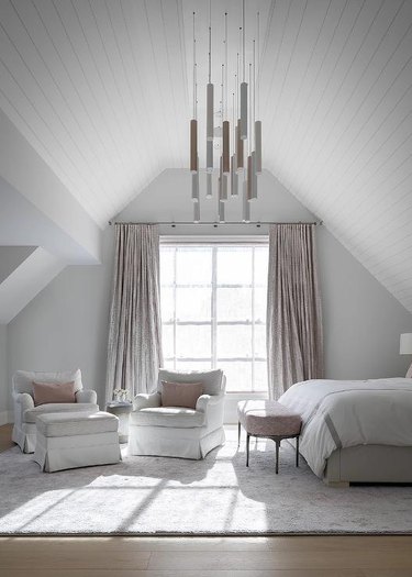 bedroom with gray walls and vaulted ceiling
