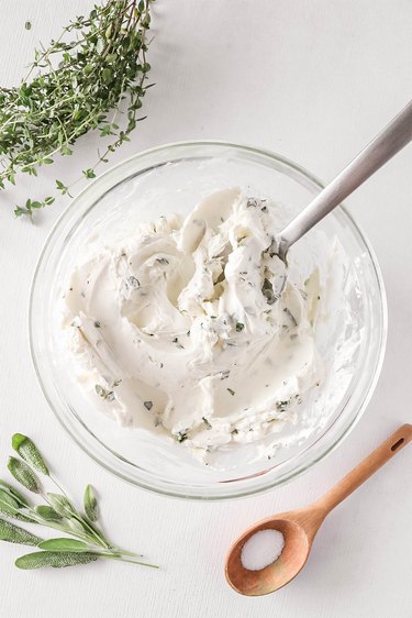 Mix cream cheese and herbs