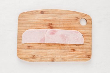 Layer the slices of deli meat