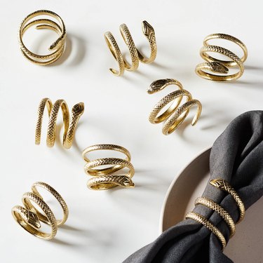 CB2 gold snake napkin rings
