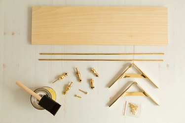 Supplies for DIY gallery shelf with brass hardware