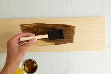 Adding stain to wood for DIY shelf