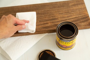Adding stain to wood for DIY shelf