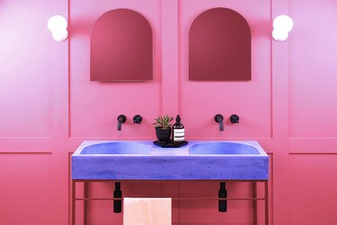 purple double vanity with pink wall